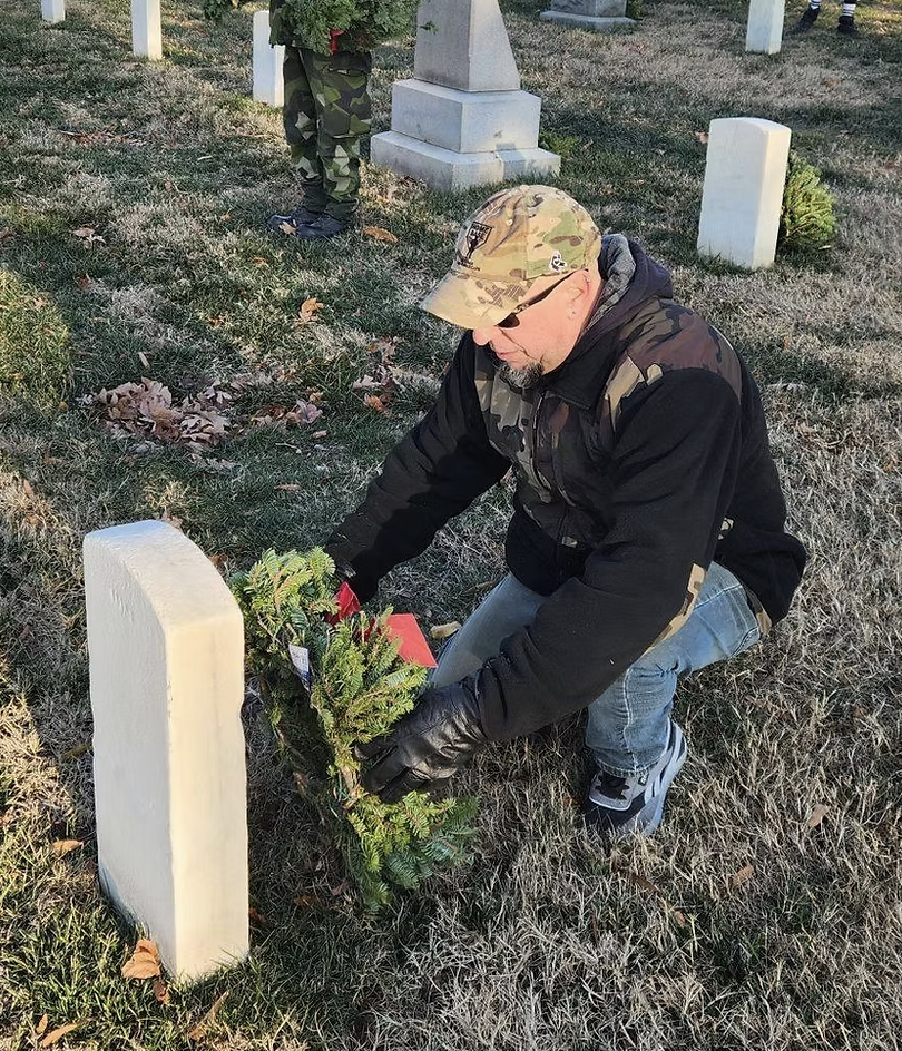 Chris Lyons laying a wreath at Arlington National Cemetery